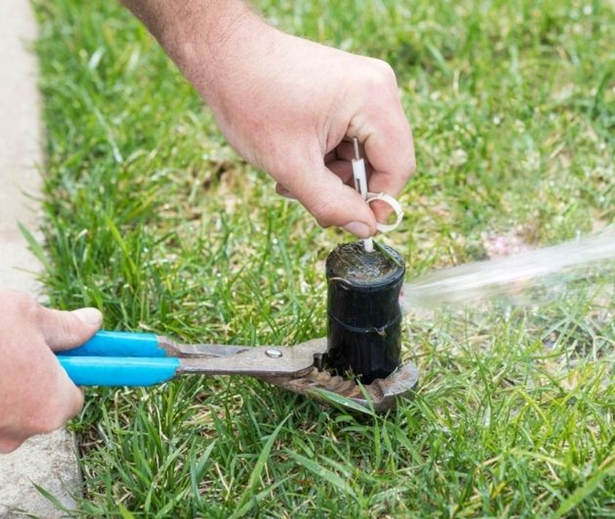 careful sprinkler activation with pliars